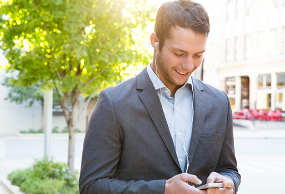 Man holding phone listening to podcasts.
